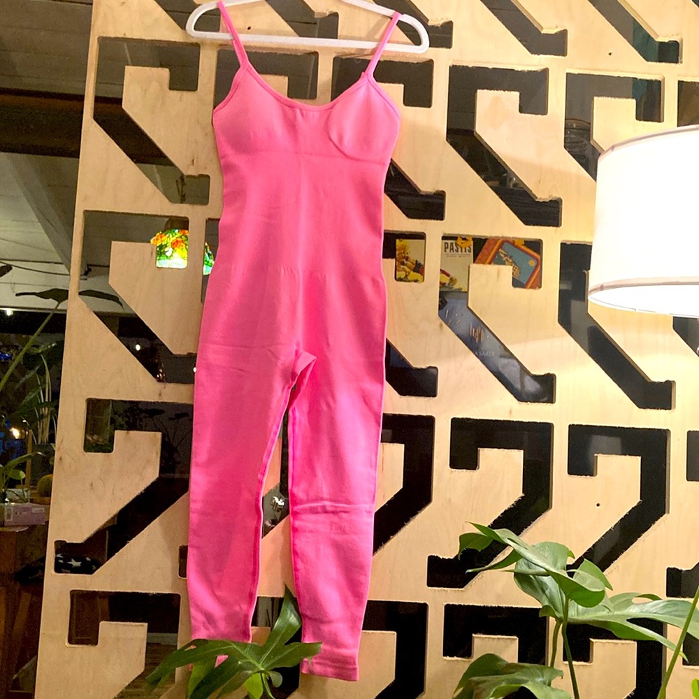 Sport neon pink second skin onesie.